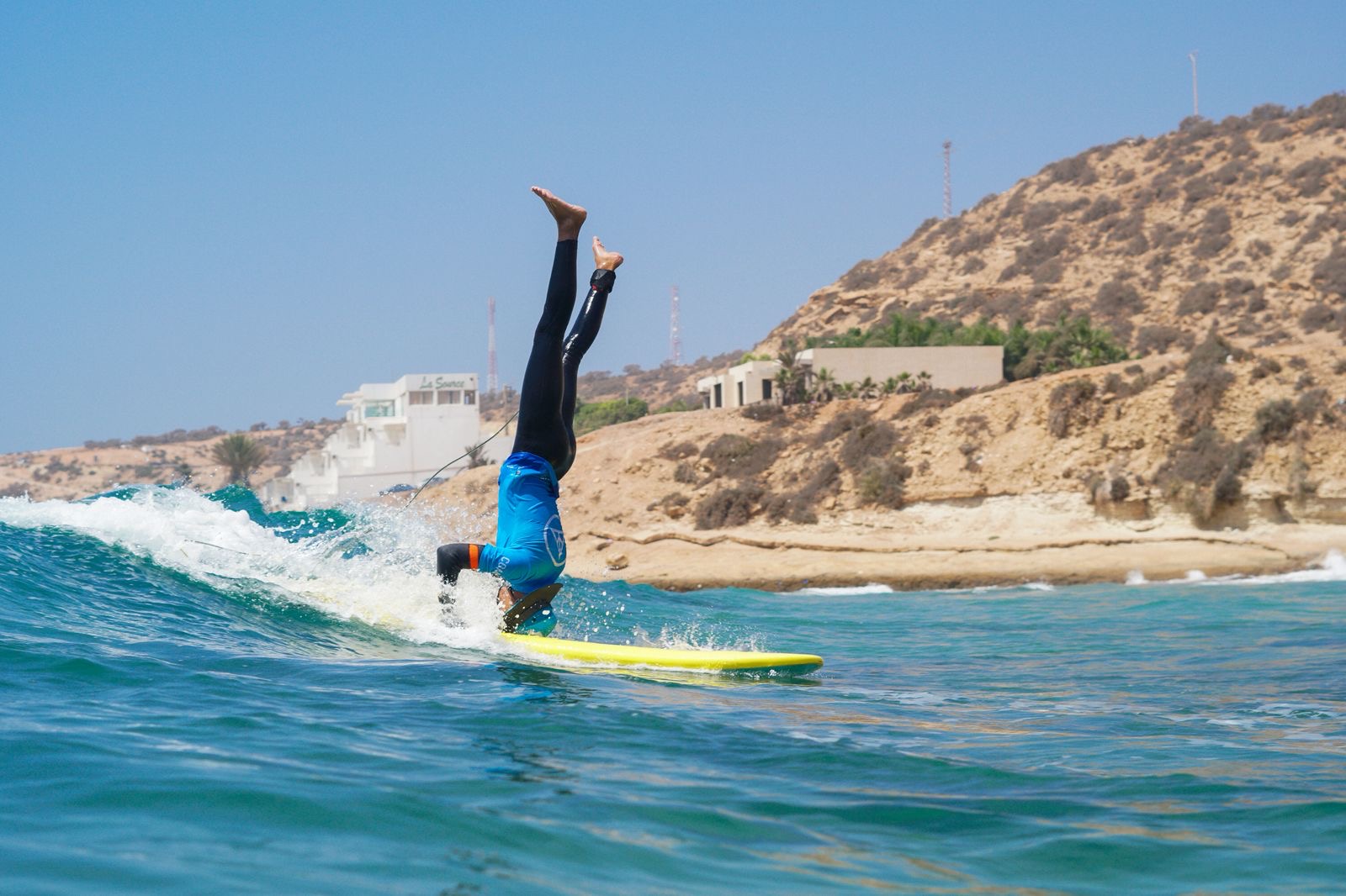 Surf coach having fun on a wave near Taghazout